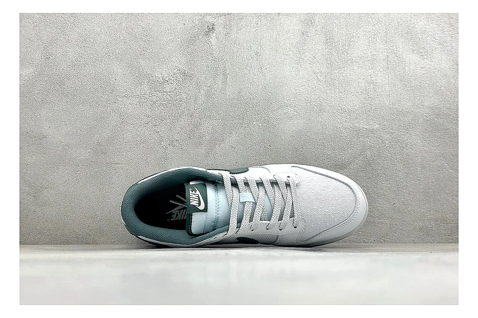 Nike SB Dunk Low White Green shopping brief photo showing white low-top skate upper, green Swoosh, padded collar, and classic Dunk sole shape thumbnail 5