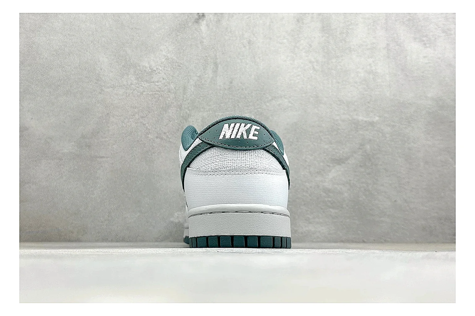 Nike SB Dunk Low White Green shopping brief photo showing white low-top skate upper, green Swoosh, padded collar, and classic Dunk sole shape thumbnail 6
