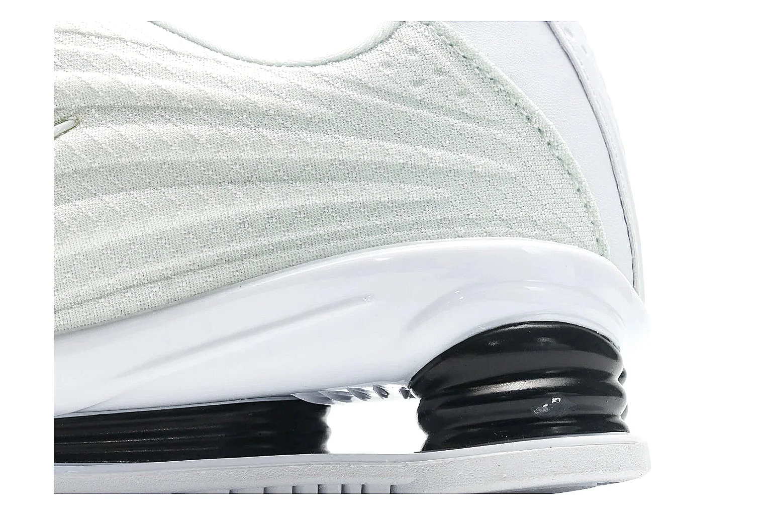 Nike Shox Z White Sneakers shopping brief photo showing white streamlined layered upper, small Swoosh, black heel cushioning columns, and modern low runner shape thumbnail 3