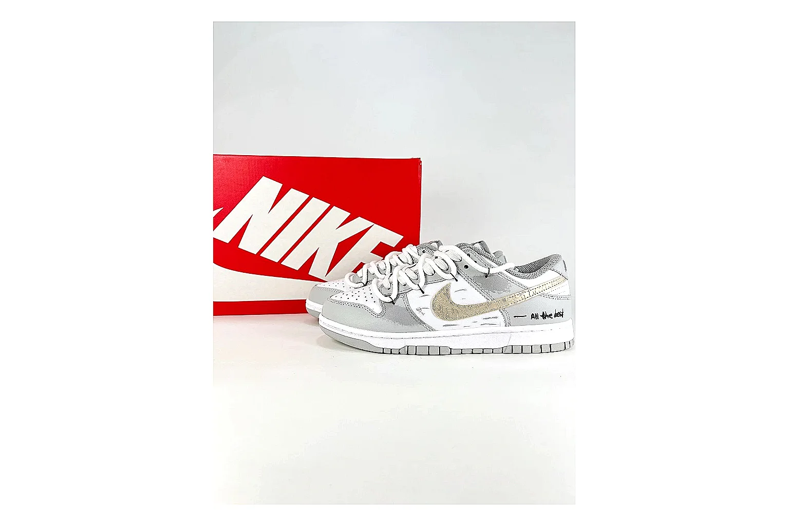 Nike Silver Runner Silver Gold shopping brief photo showing silver synthetic-mesh upper, gold accent details, modern runner shape, and cushioned sole