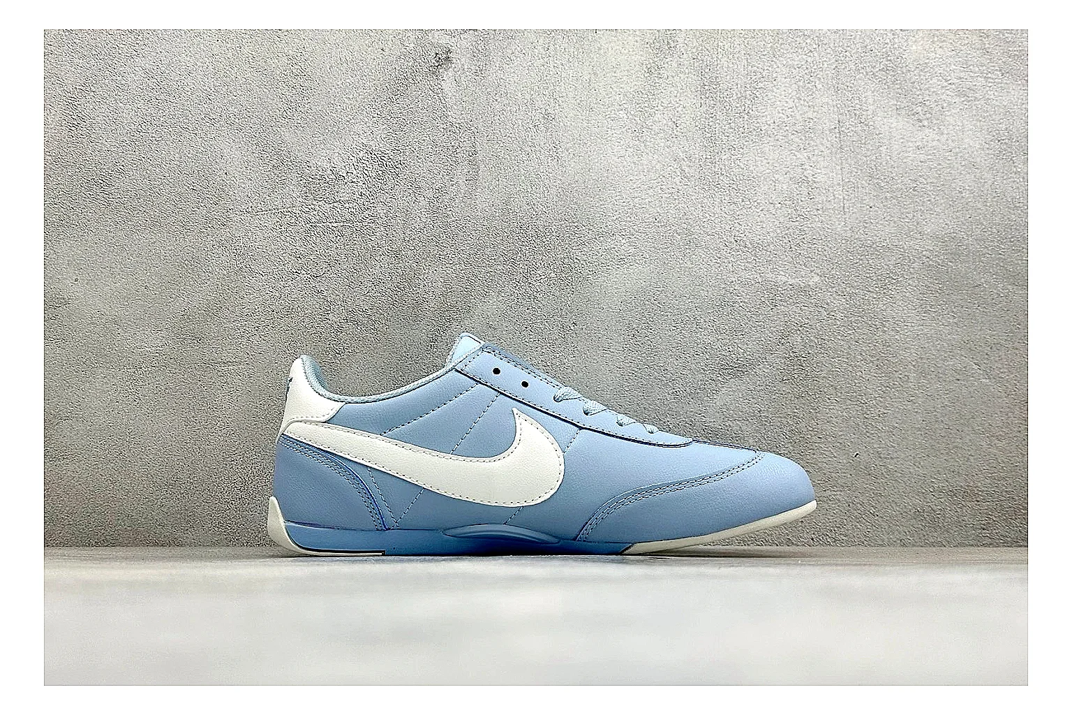 Nike Sprint Sister Light Blue shopping brief photo showing light blue retro-runner upper, slim side profile, tonal panels, and low everyday sole thumbnail 4