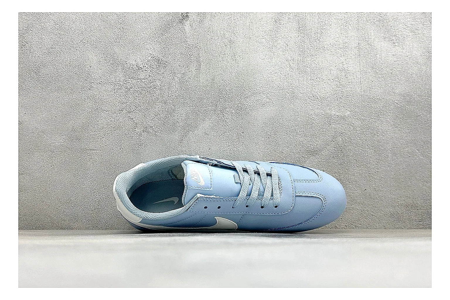 Nike Sprint Sister Light Blue shopping brief photo showing light blue retro-runner upper, slim side profile, tonal panels, and low everyday sole thumbnail 5