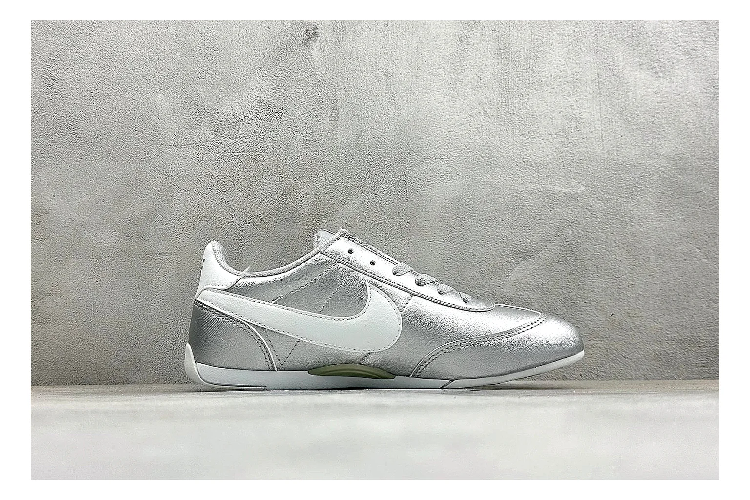 Nike Sprint Sister Silver shopping brief photo showing silver retro-runner upper, slim low-top shape, layered side panels, and a light everyday sole thumbnail 4