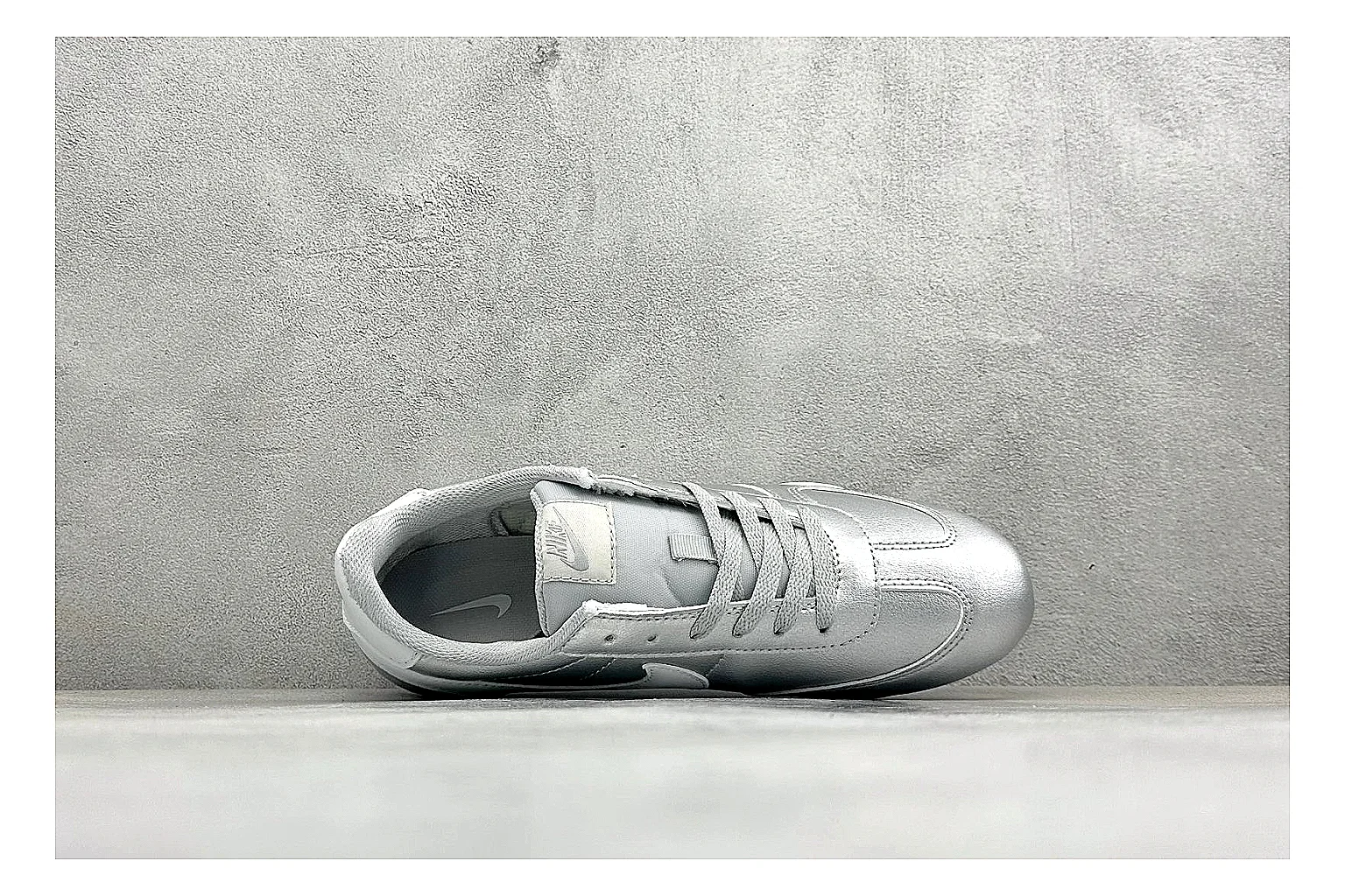Nike Sprint Sister Silver shopping brief photo showing silver retro-runner upper, slim low-top shape, layered side panels, and a light everyday sole thumbnail 5