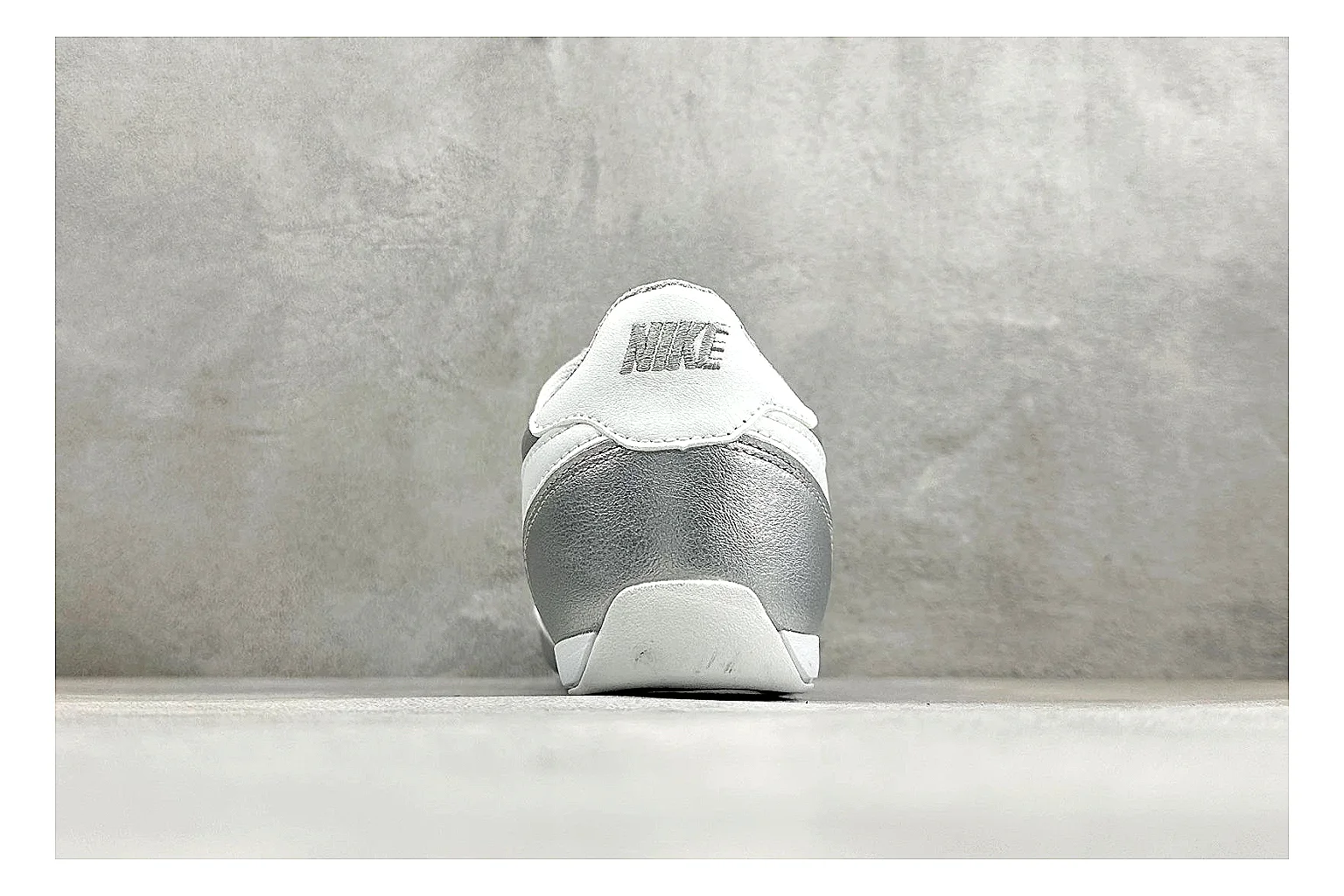 Nike Sprint Sister Silver shopping brief photo showing silver retro-runner upper, slim low-top shape, layered side panels, and a light everyday sole thumbnail 6