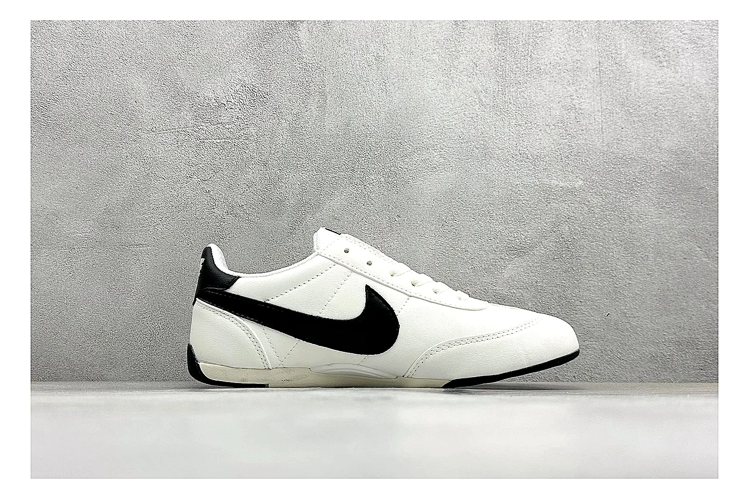 Nike Sprint Sister White Black shopping brief photo showing white retro-runner upper, black Swoosh contrast, slim low-top profile, and light casual sole thumbnail 4
