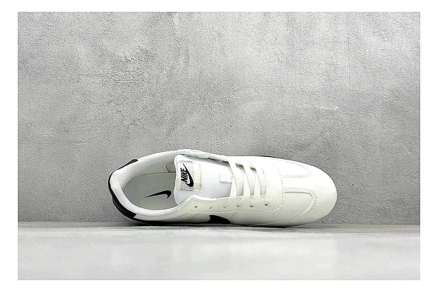Nike Sprint Sister White Black shopping brief photo showing white retro-runner upper, black Swoosh contrast, slim low-top profile, and light casual sole thumbnail 5