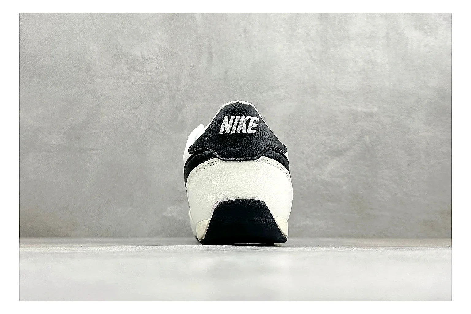 Nike Sprint Sister White Black shopping brief photo showing white retro-runner upper, black Swoosh contrast, slim low-top profile, and light casual sole thumbnail 6