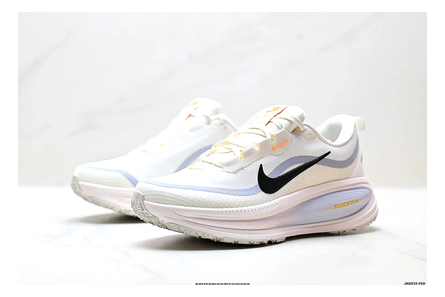 Nike Vomero White Orange shopping brief photo showing white mesh runner upper, orange accents, layered Vomero-style panels, and cushioned modern sole thumbnail 2