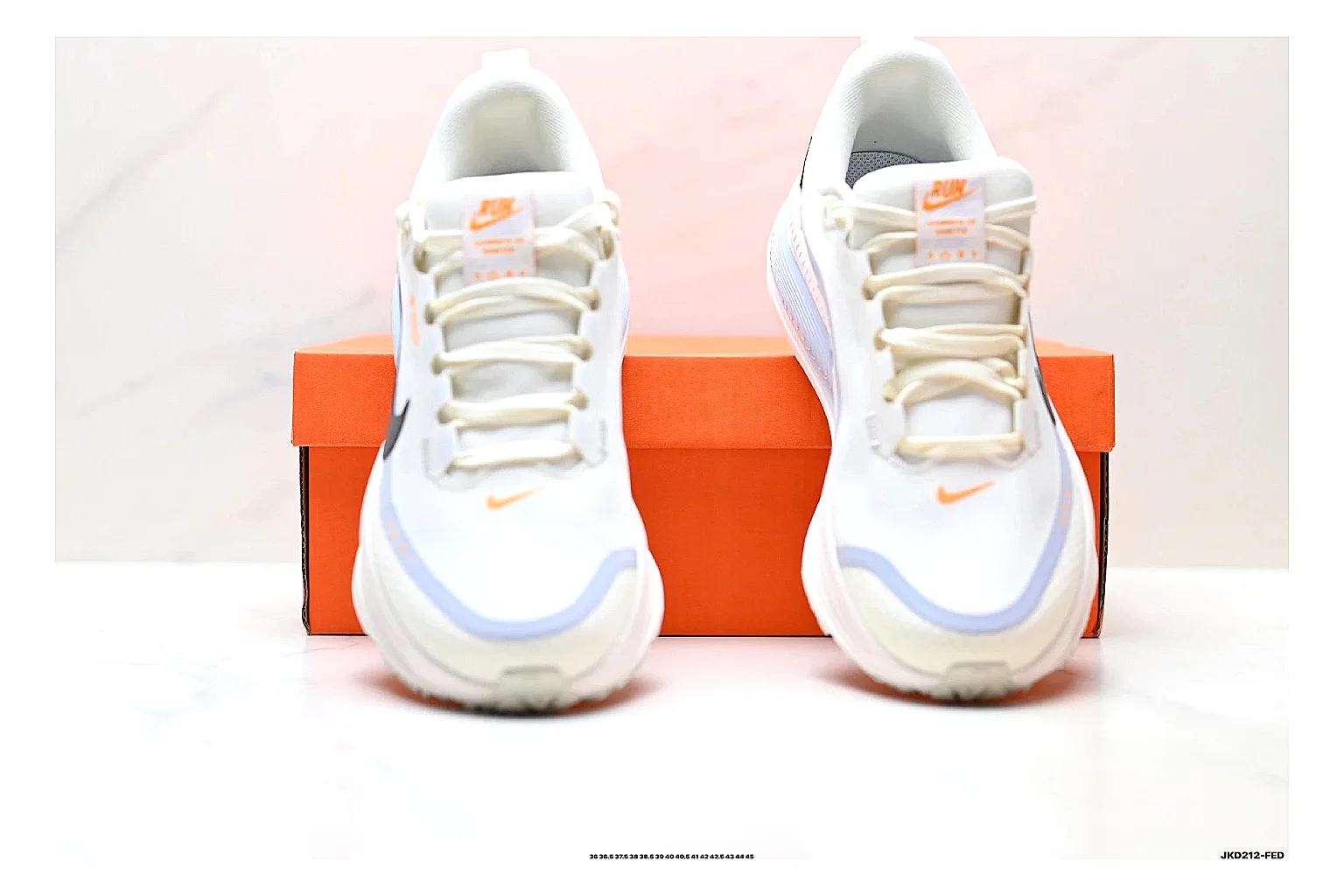 Nike Vomero White Orange shopping brief photo showing white mesh runner upper, orange accents, layered Vomero-style panels, and cushioned modern sole thumbnail 3