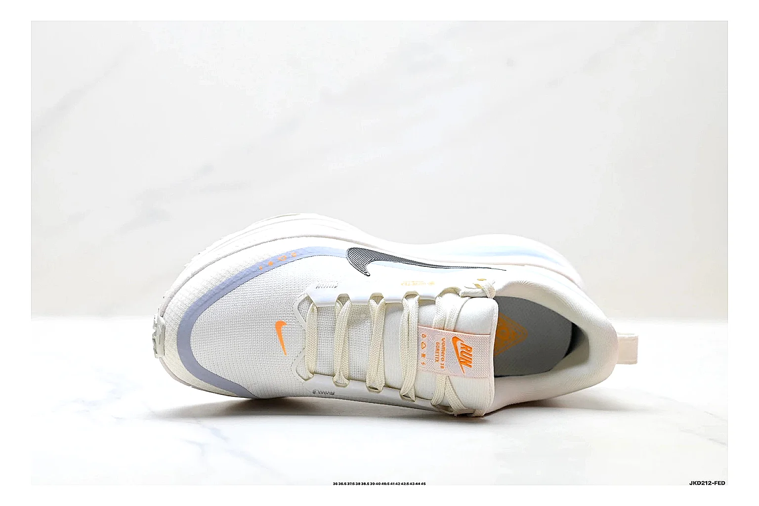 Nike Vomero White Orange shopping brief photo showing white mesh runner upper, orange accents, layered Vomero-style panels, and cushioned modern sole thumbnail 4