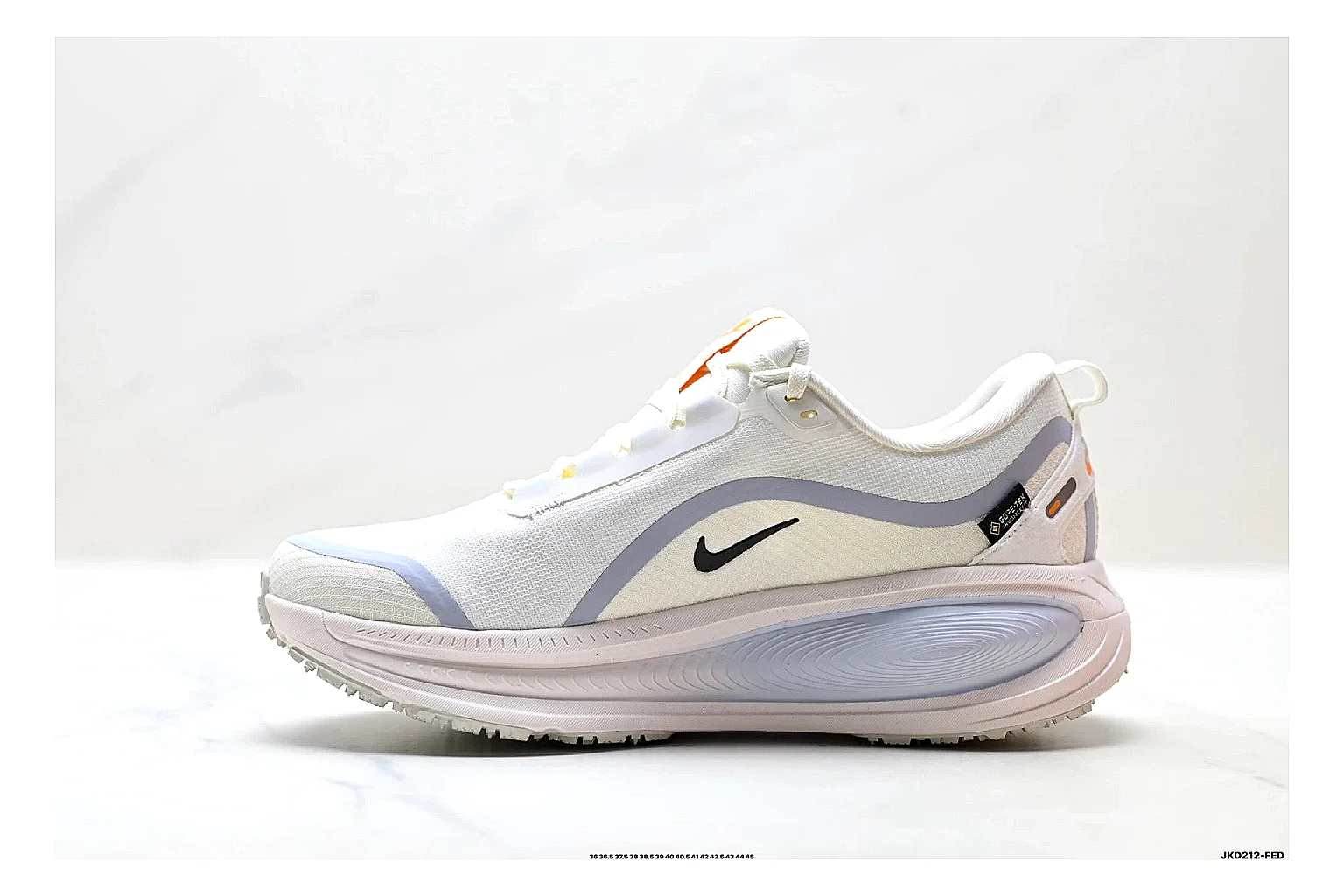 Nike Vomero White Orange shopping brief photo showing white mesh runner upper, orange accents, layered Vomero-style panels, and cushioned modern sole thumbnail 5