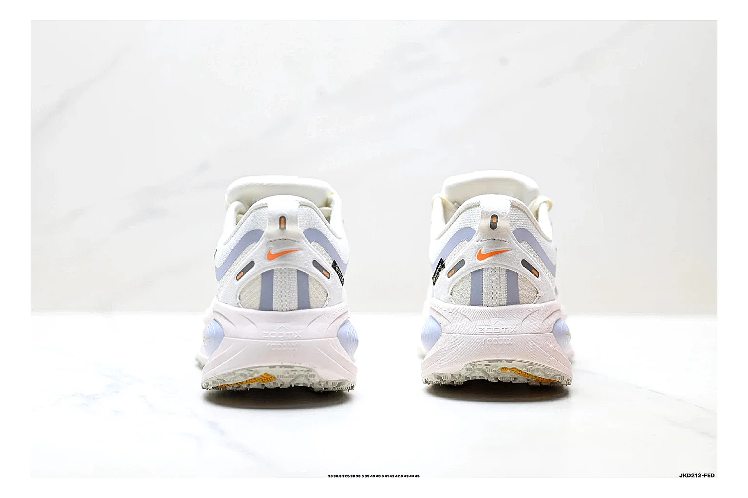 Nike Vomero White Orange shopping brief photo showing white mesh runner upper, orange accents, layered Vomero-style panels, and cushioned modern sole thumbnail 6