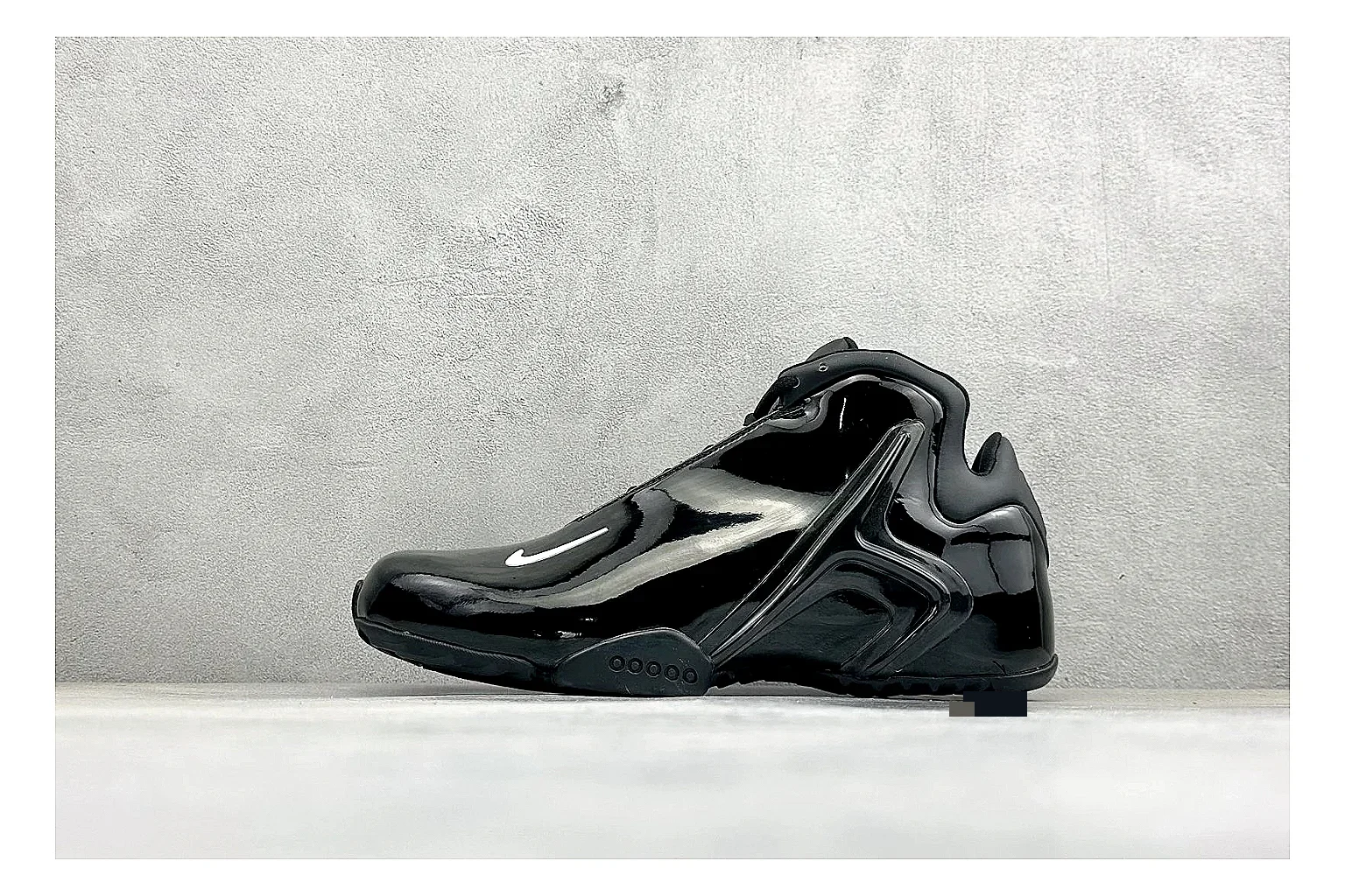Nike Zoom Hyperflight Black shopping brief photo showing glossy black basketball upper, sleek shell shape, subtle Swoosh detail, and sculpted court sole