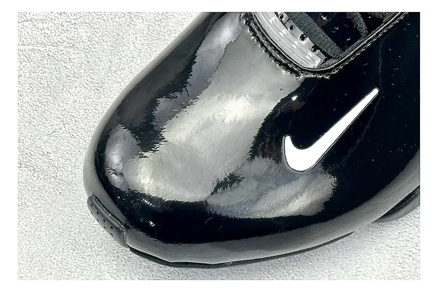 Nike Zoom Hyperflight Black shopping brief photo showing glossy black basketball upper, sleek shell shape, subtle Swoosh detail, and sculpted court sole thumbnail 3