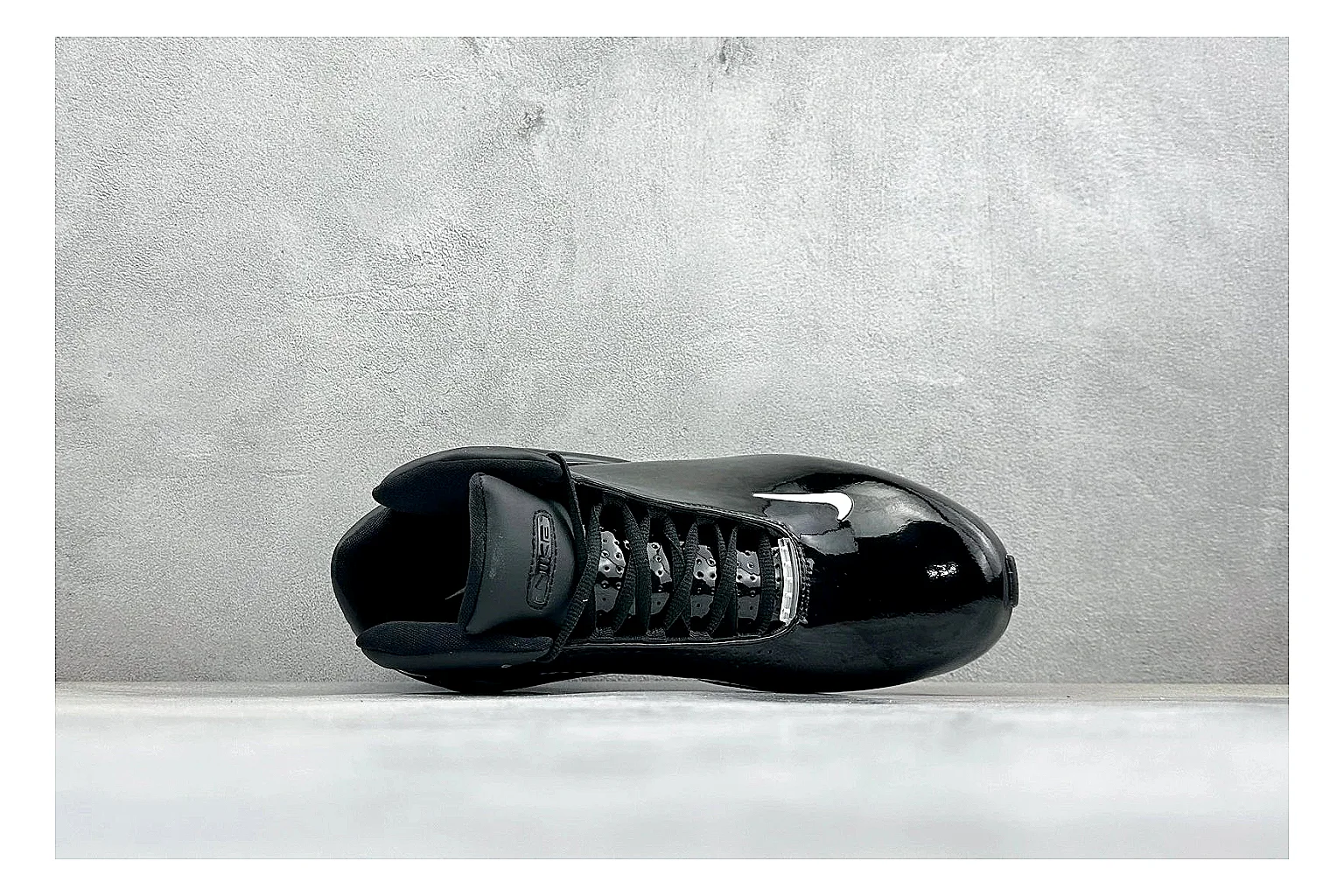 Nike Zoom Hyperflight Black shopping brief photo showing glossy black basketball upper, sleek shell shape, subtle Swoosh detail, and sculpted court sole thumbnail 5