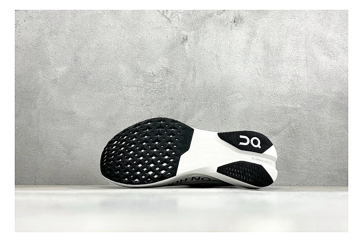 On Cloudboom White Black shopping brief photo showing white performance mesh, black contrast details, slim racing profile, and segmented CloudTec sole thumbnail 2