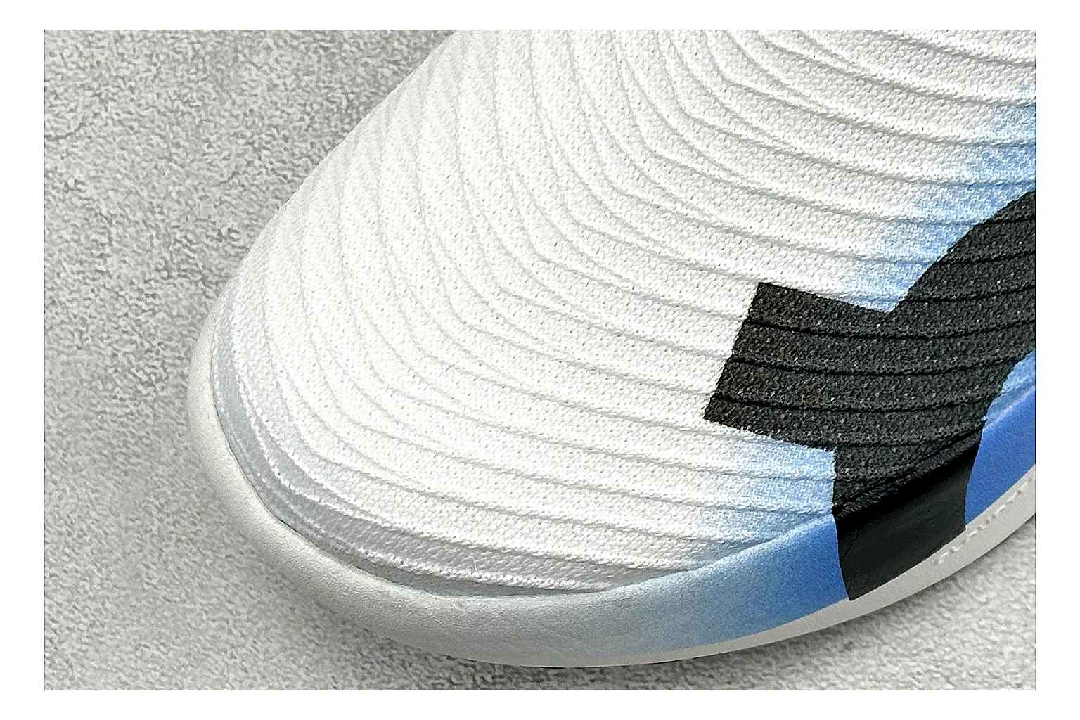 On Cloudboom White Blue shopping brief photo showing white performance mesh, blue gradient accents, slim racing profile, and segmented CloudTec sole thumbnail 3