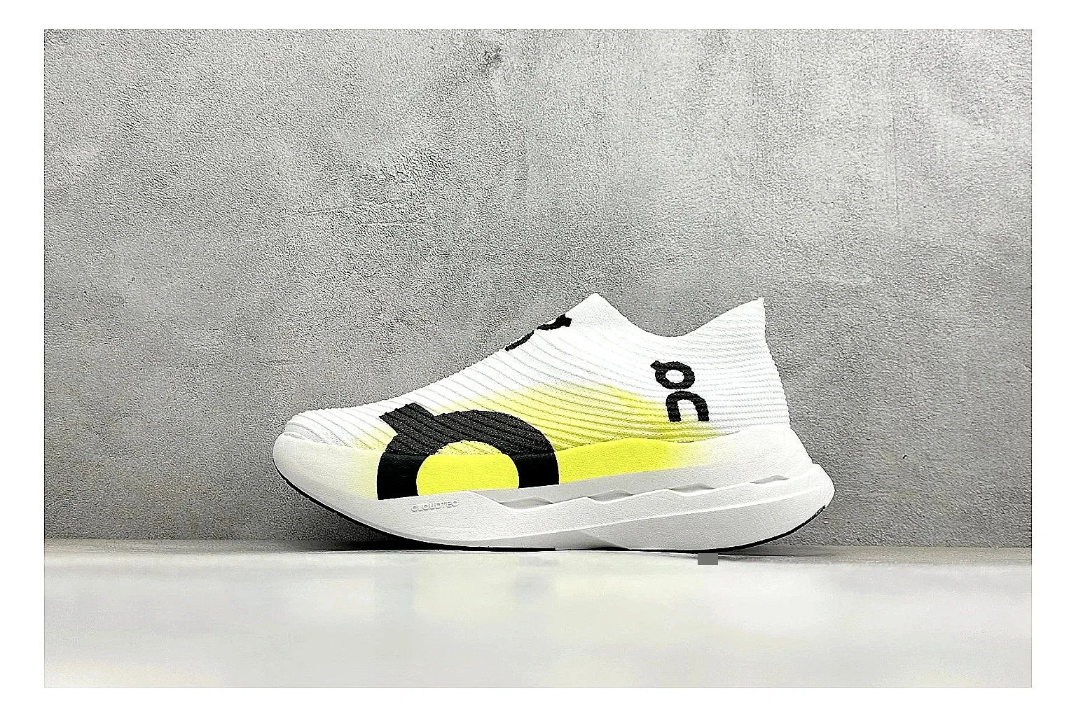On Cloudboom White Lime shopping brief photo showing white performance mesh, lime gradient accents, slim racing profile, and segmented CloudTec sole
