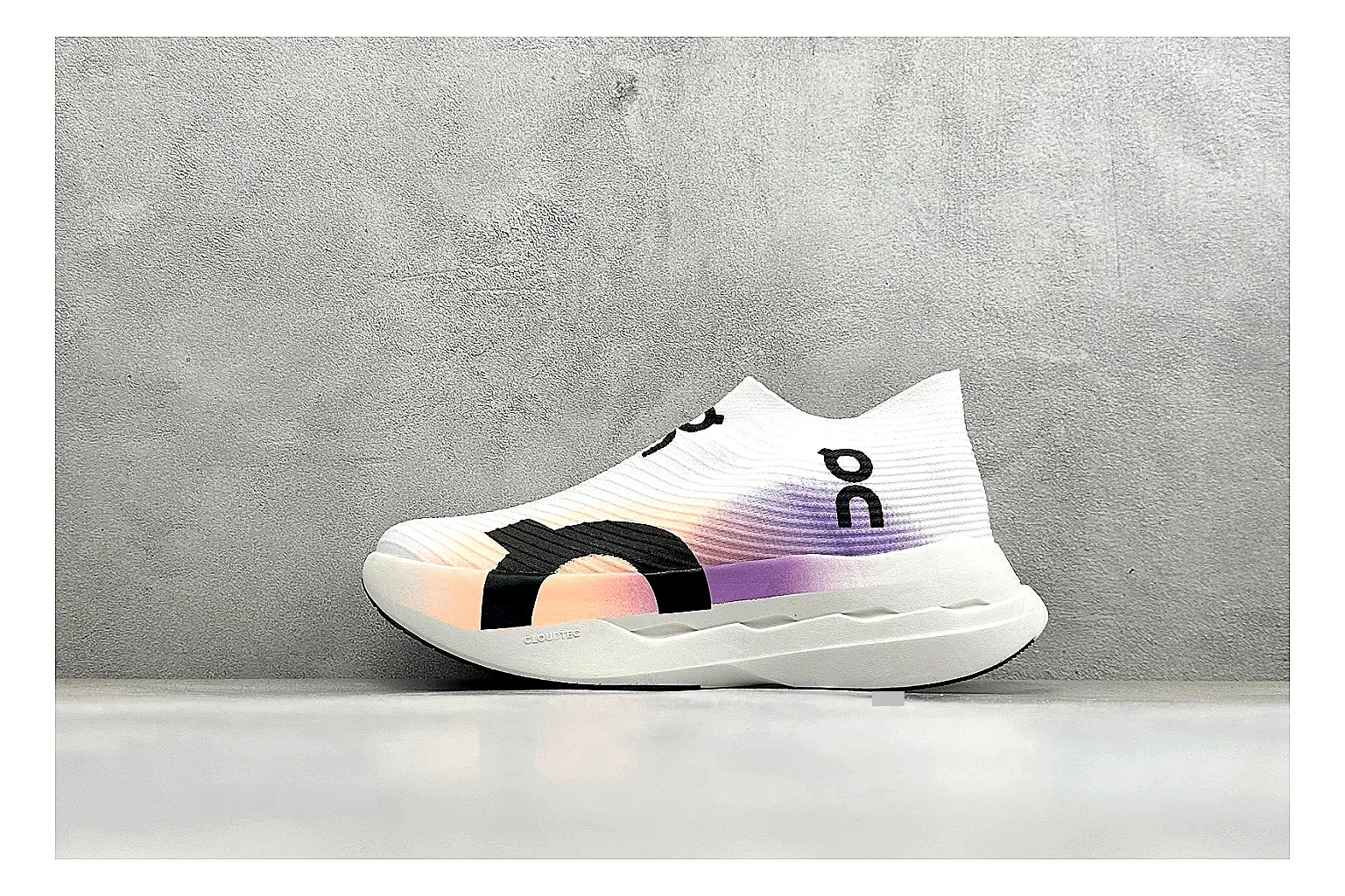 On Cloudboom White Peach shopping brief photo showing white performance mesh, peach gradient accents, slim racing profile, and segmented CloudTec sole