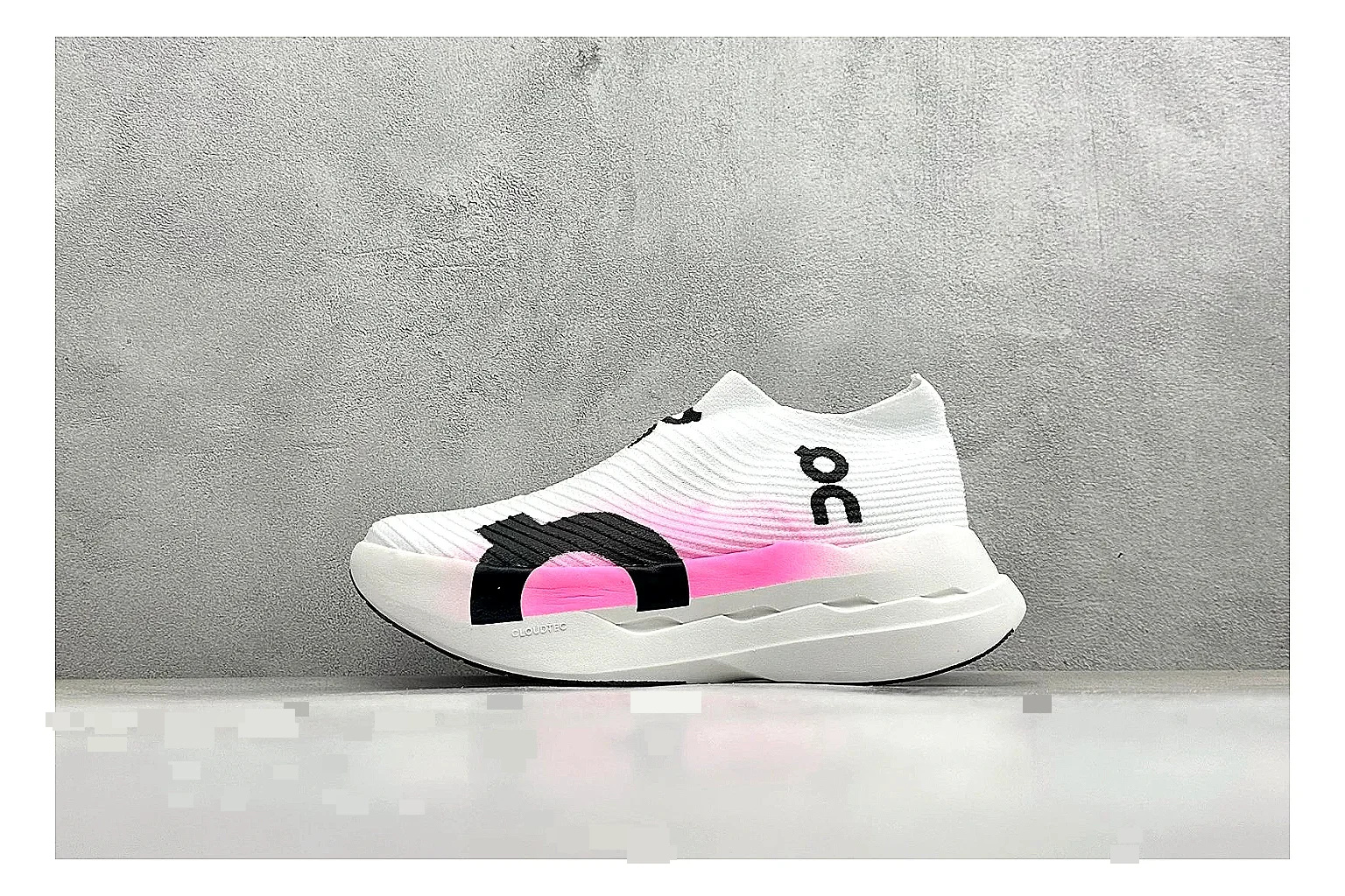 On Cloudboom White Pink shopping brief photo showing white running mesh, pink gradient accents, low racing shape, and segmented CloudTec sole