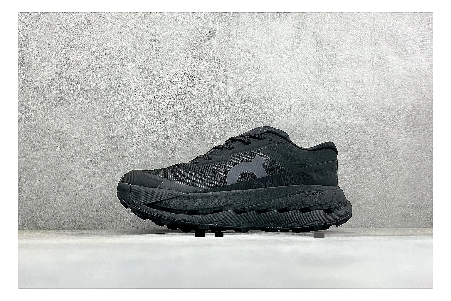 On Cloudmonster Triple Black shopping brief photo showing triple black mesh upper, oversized CloudTec sole pods, tonal laces, and rounded runner shape