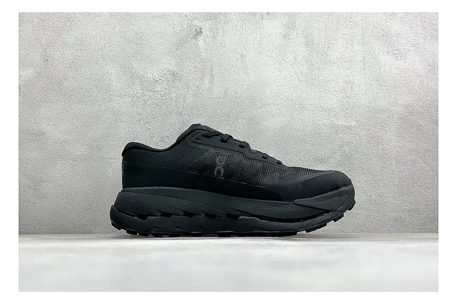 On Cloudmonster Triple Black shopping brief photo showing triple black mesh upper, oversized CloudTec sole pods, tonal laces, and rounded runner shape thumbnail 4