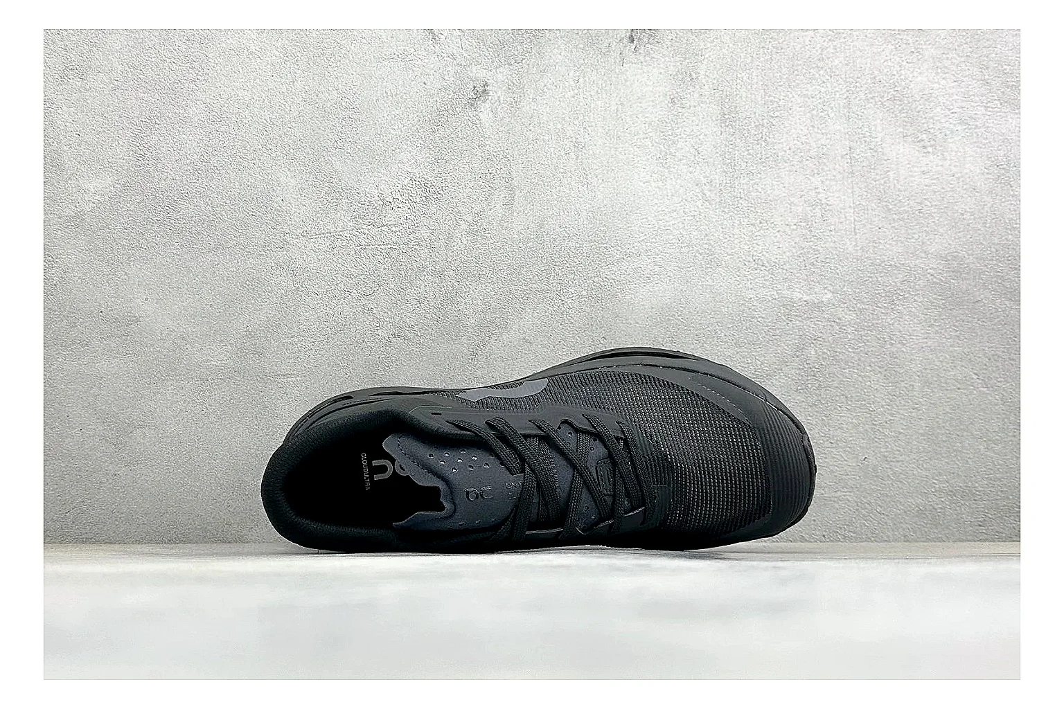 On Cloudmonster Triple Black shopping brief photo showing triple black mesh upper, oversized CloudTec sole pods, tonal laces, and rounded runner shape thumbnail 5
