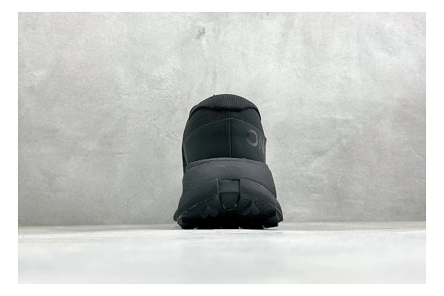 On Cloudmonster Triple Black shopping brief photo showing triple black mesh upper, oversized CloudTec sole pods, tonal laces, and rounded runner shape thumbnail 6