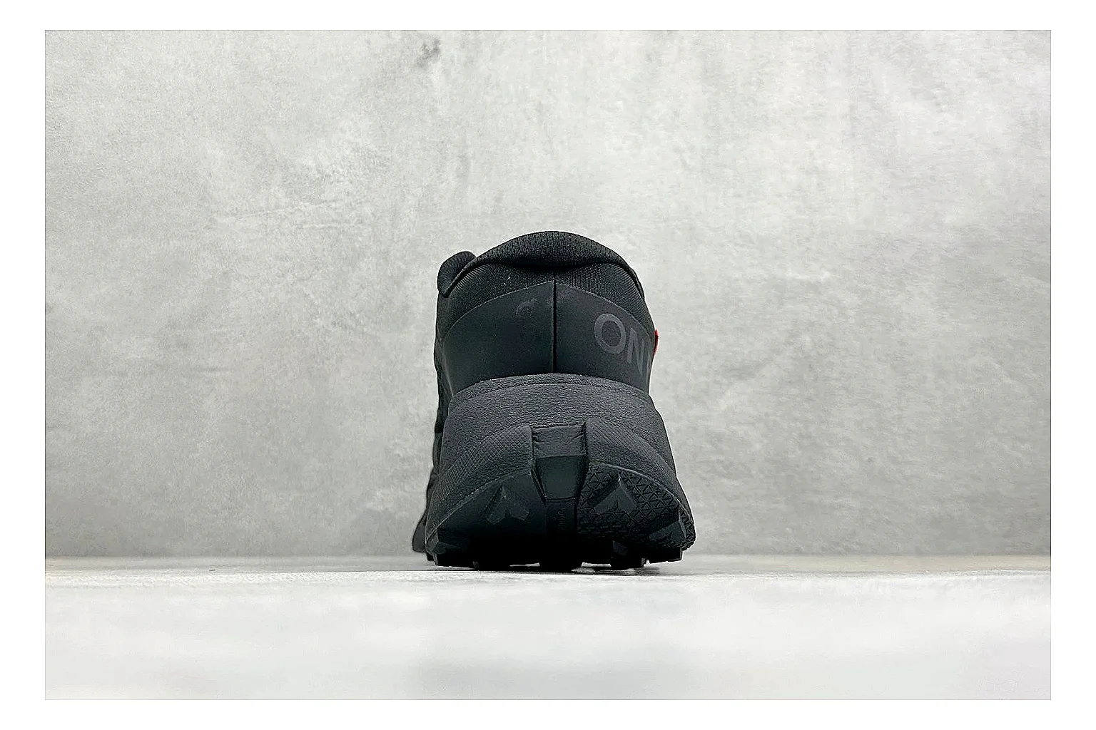 On Cloudmonster Triple Black shopping brief photo showing triple black running upper, oversized CloudTec pod sole, tonal laces, and rounded performance shape thumbnail 6