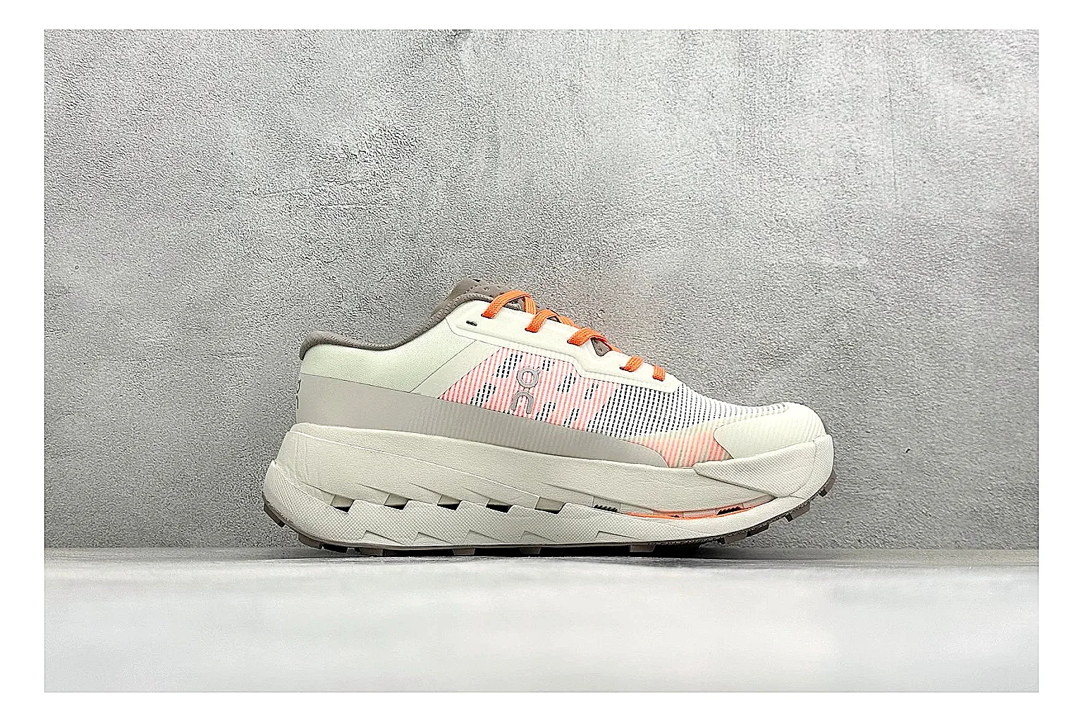 On Cloudmonster White Orange shopping brief photo showing white running mesh, orange accent hits, oversized CloudTec sole pods, and a rounded runner silhouette thumbnail 4