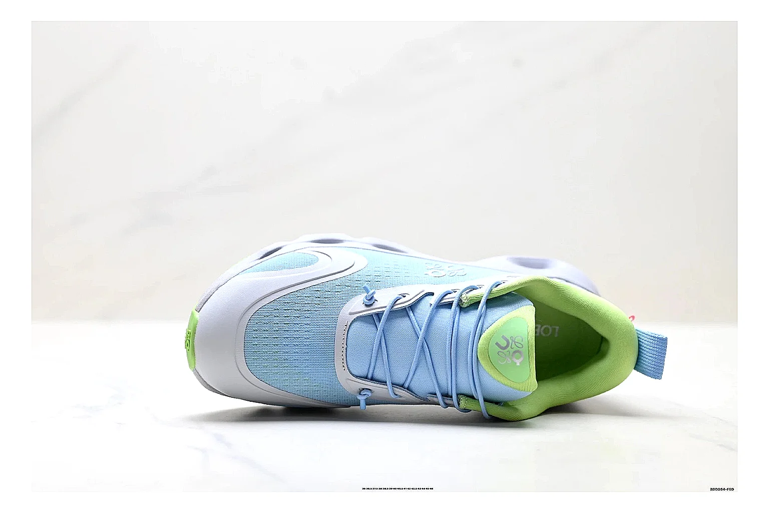 On Cloudsurfer Sky Blue Green Sneakers shopping brief image showing sky blue green running sneakers with mesh texture, side-profile shape, upper panel lines, and outsole detail thumbnail 5