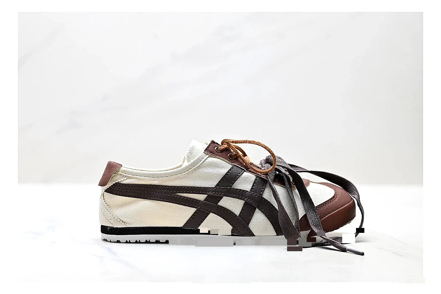 Onitsuka Tiger Mexico 66 Brown Cream Sneakers shopping brief image showing brown cream low-top sneakers with leather texture, side-profile shape, upper panel lines, and outsole detail