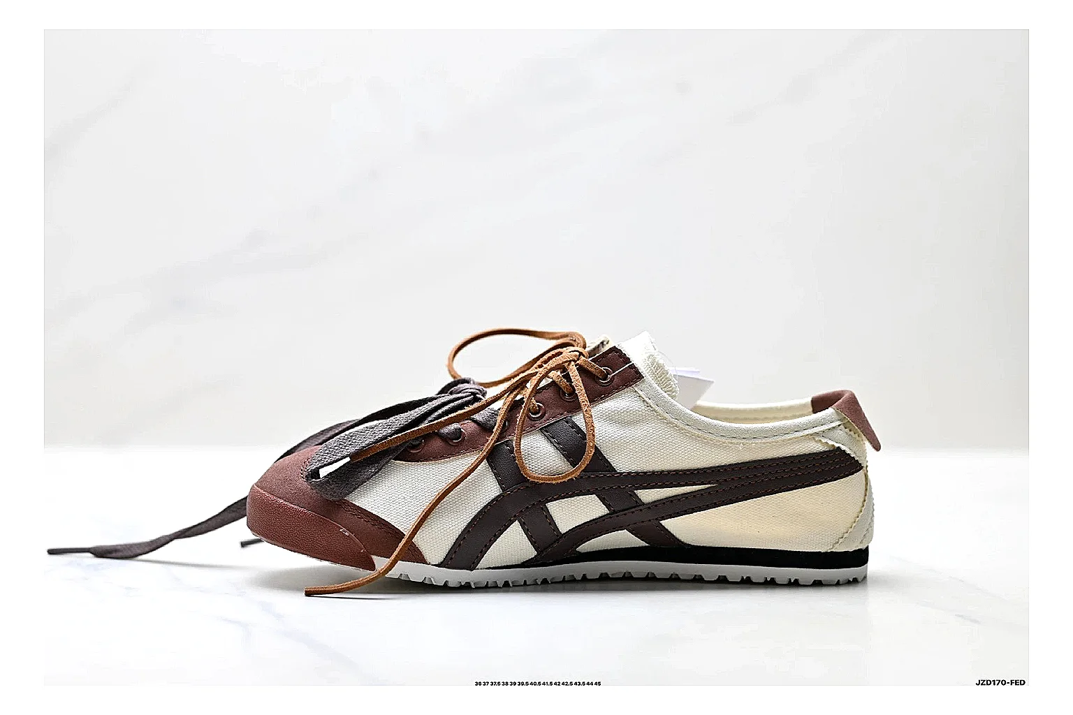 Onitsuka Tiger Mexico 66 Brown Cream Sneakers shopping brief image showing brown cream low-top sneakers with leather texture, side-profile shape, upper panel lines, and outsole detail thumbnail 4