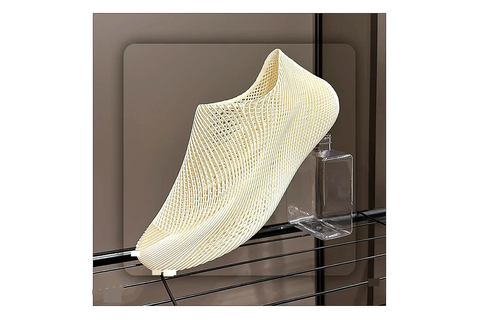 Other 4D Printed Cream Slip-On Sneakers shopping brief photo showing cream open-grid upper, seamless slip-on profile, sculpted sole, and soft futuristic casual shape