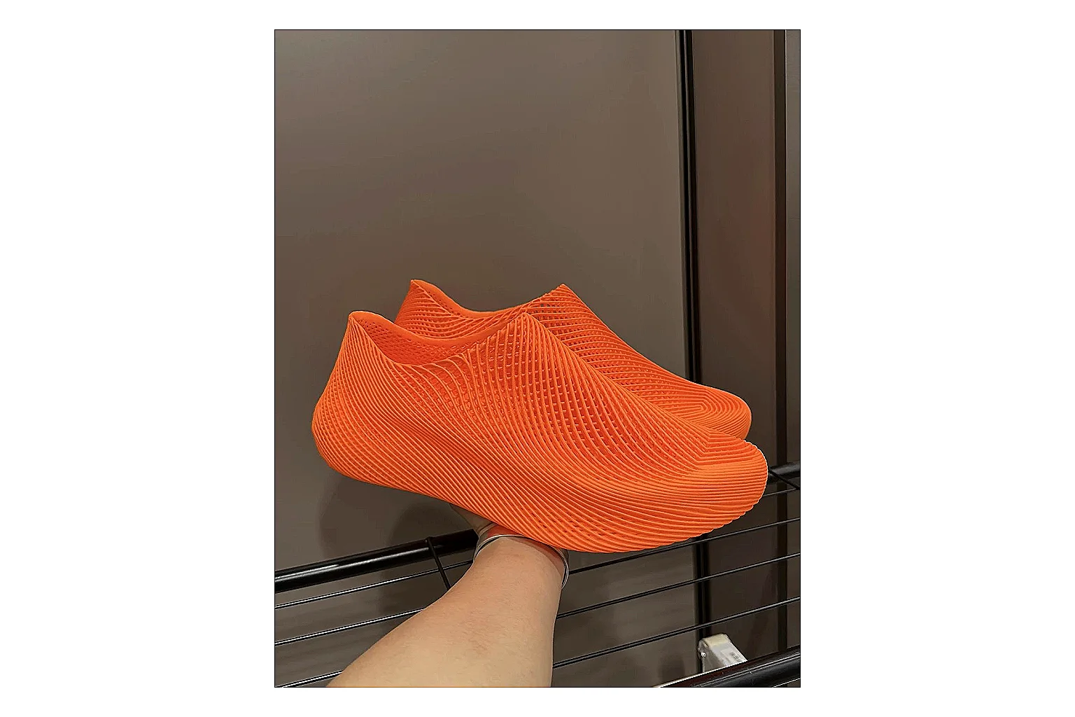 Other 4D Printed Orange Slip-On Sneakers shopping brief photo showing orange open-grid upper, seamless slip-on shape, sculpted sole, and futuristic lightweight profile thumbnail 4