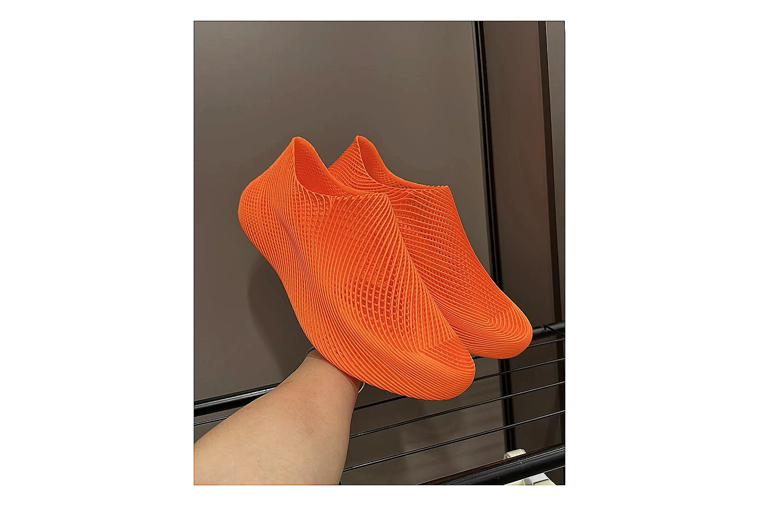 Other 4D Printed Orange Slip-On Sneakers shopping brief photo showing orange open-grid upper, seamless slip-on shape, sculpted sole, and futuristic lightweight profile thumbnail 6