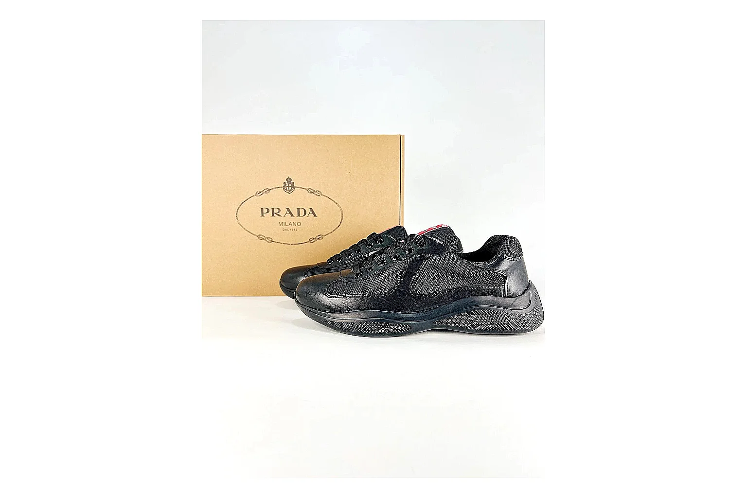 Black Runner Black Sneaker shopping brief photo showing black mesh runner upper, tonal overlays, modern running shape, and dark cushioned sole