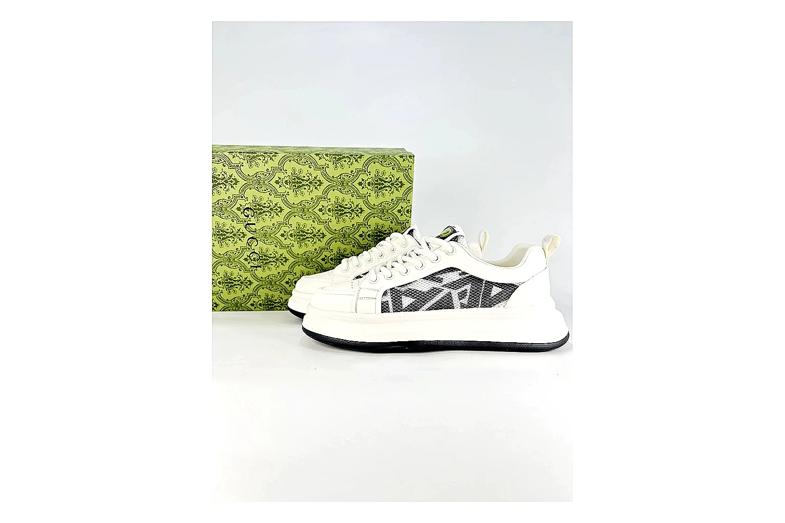 Low Runner White Black Sneaker shopping brief photo showing white black synthetic low-top upper, minimal runner shape, clean panels, and casual sole