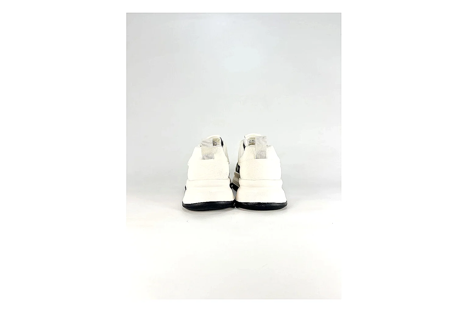 Low Runner White Black Sneaker shopping brief photo showing white black synthetic low-top upper, minimal runner shape, clean panels, and casual sole thumbnail 2