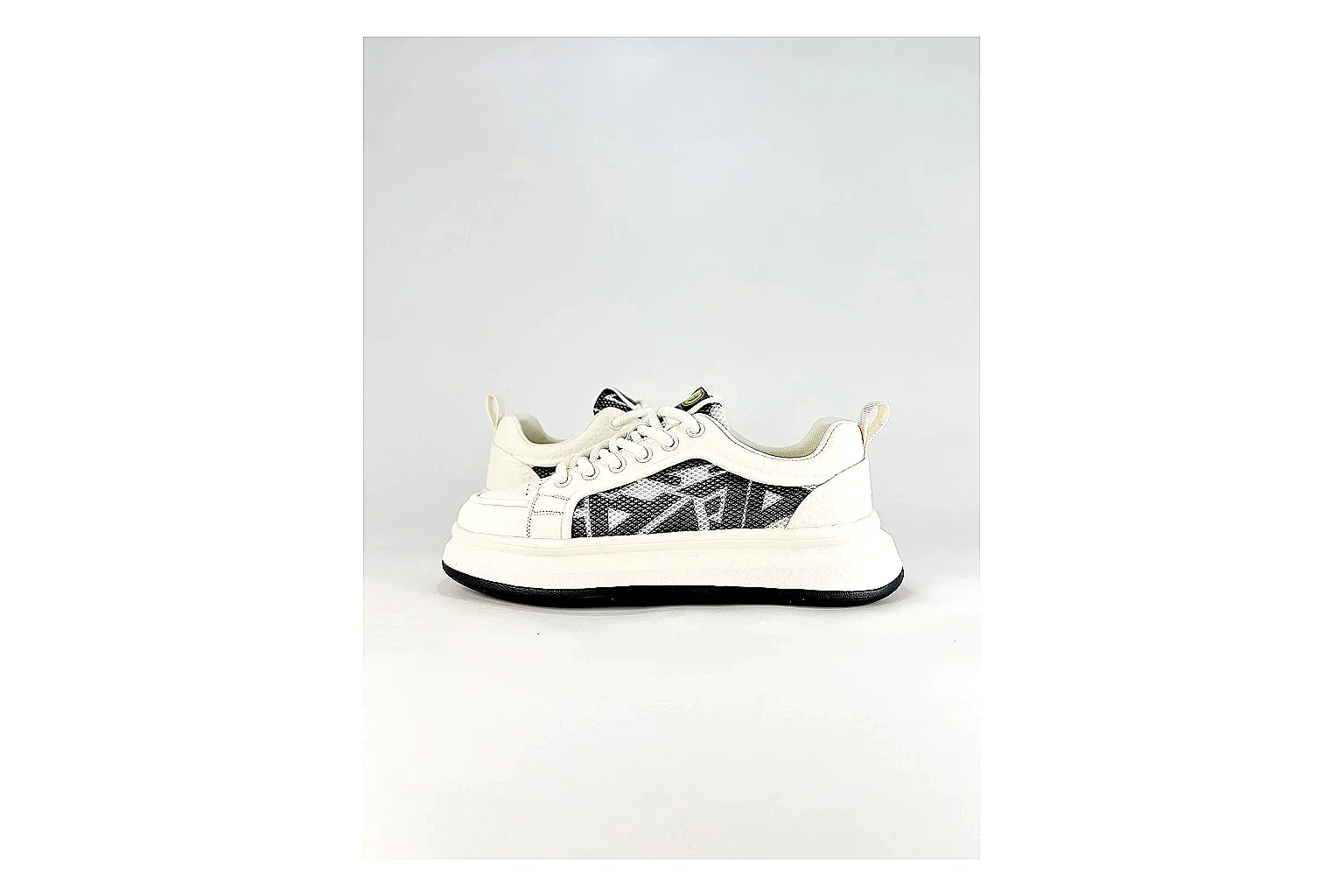 Low Runner White Black Sneaker shopping brief photo showing white black synthetic low-top upper, minimal runner shape, clean panels, and casual sole thumbnail 4