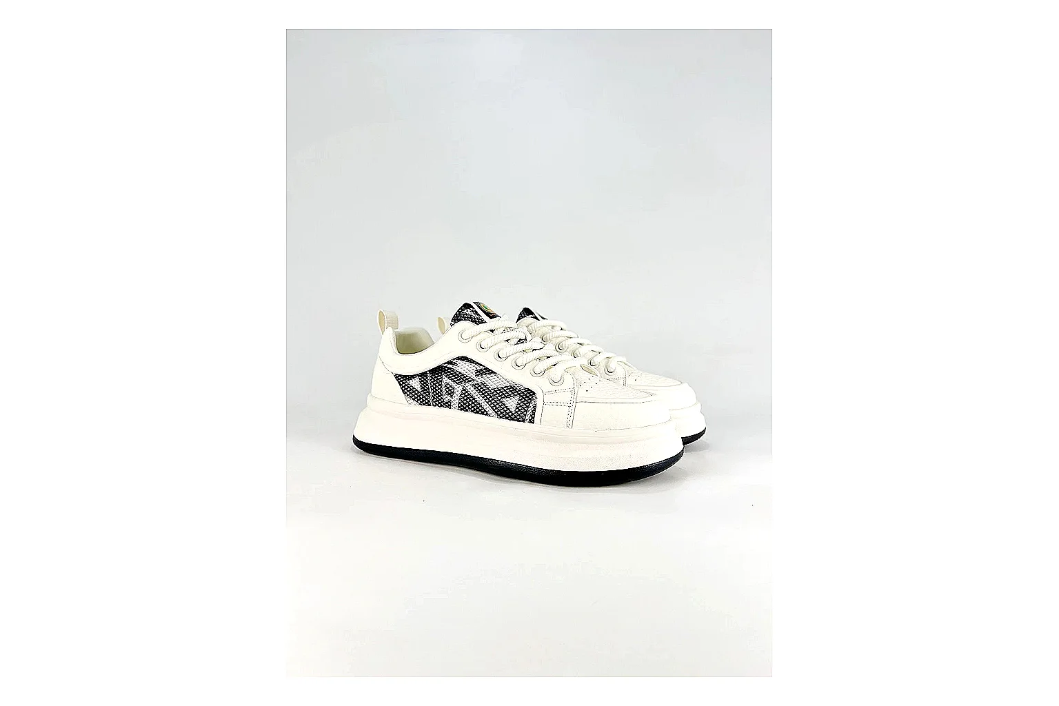 Low Runner White Black Sneaker shopping brief photo showing white black synthetic low-top upper, minimal runner shape, clean panels, and casual sole thumbnail 5