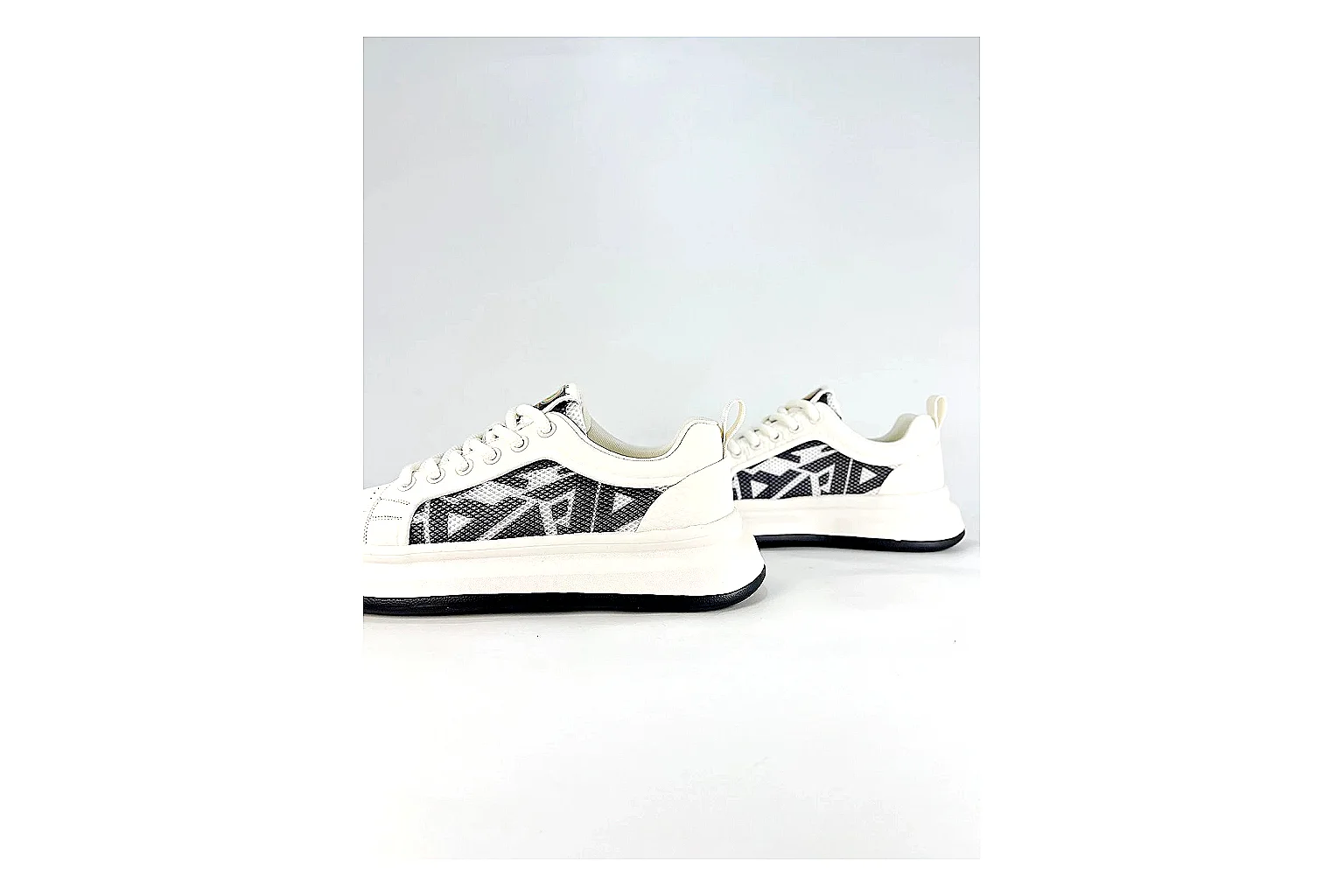 Low Runner White Black Sneaker shopping brief photo showing white black synthetic low-top upper, minimal runner shape, clean panels, and casual sole thumbnail 6