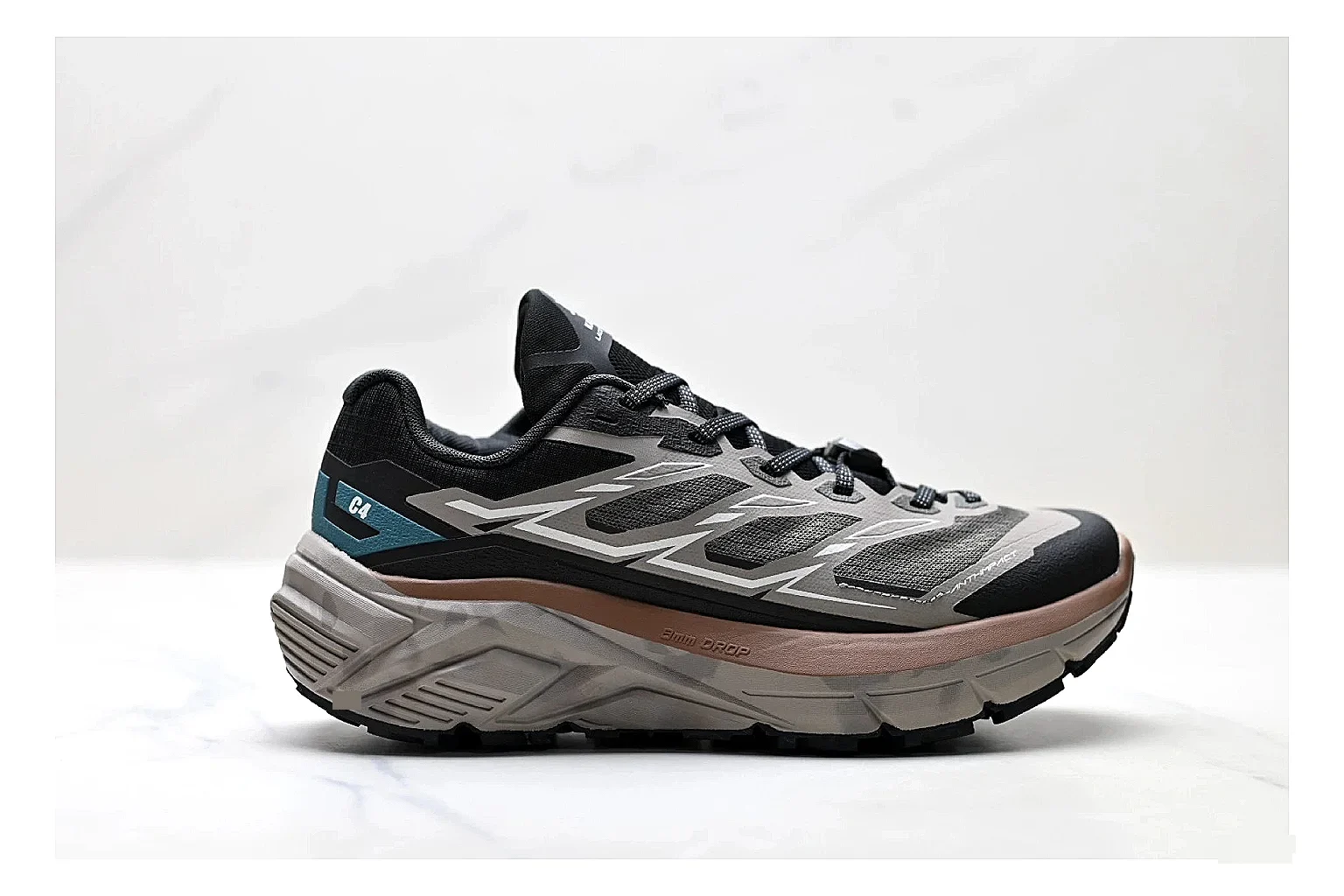 Trail Runner Black Teal Sneaker shopping brief photo showing black mesh runner upper, teal accent details, rugged trail profile, and traction sole