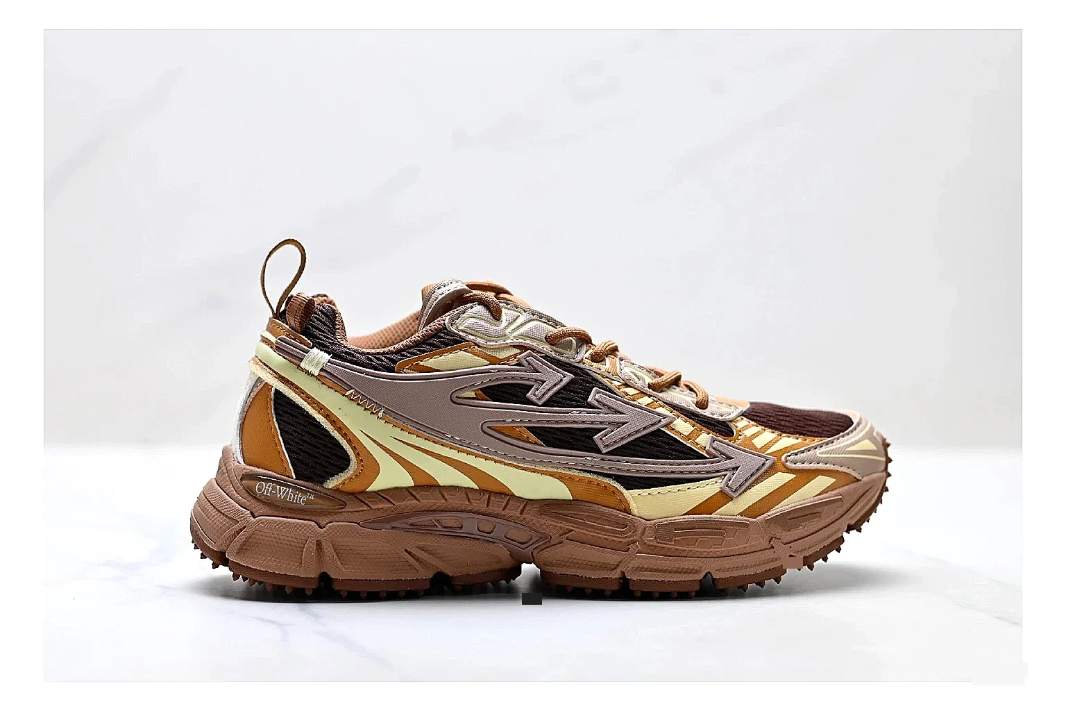 Trail Runner Brown Gold Sneaker shopping brief photo showing brown gold mesh-suede runner upper, rugged trail profile, protective overlays, and traction sole