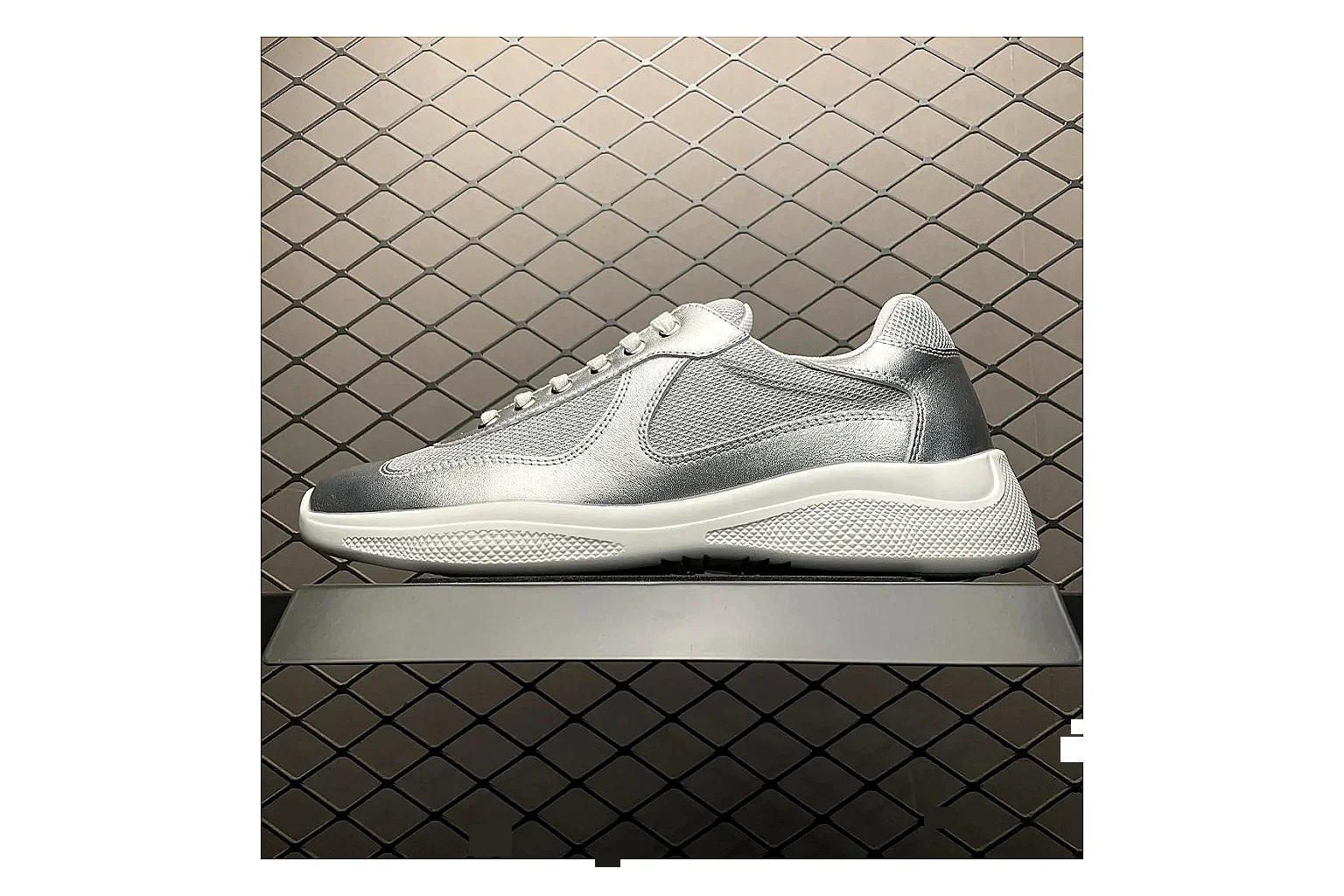 Prada America Cup Silver Sneaker shopping brief image showing silver america cup low-top with mixed upper and low top shape