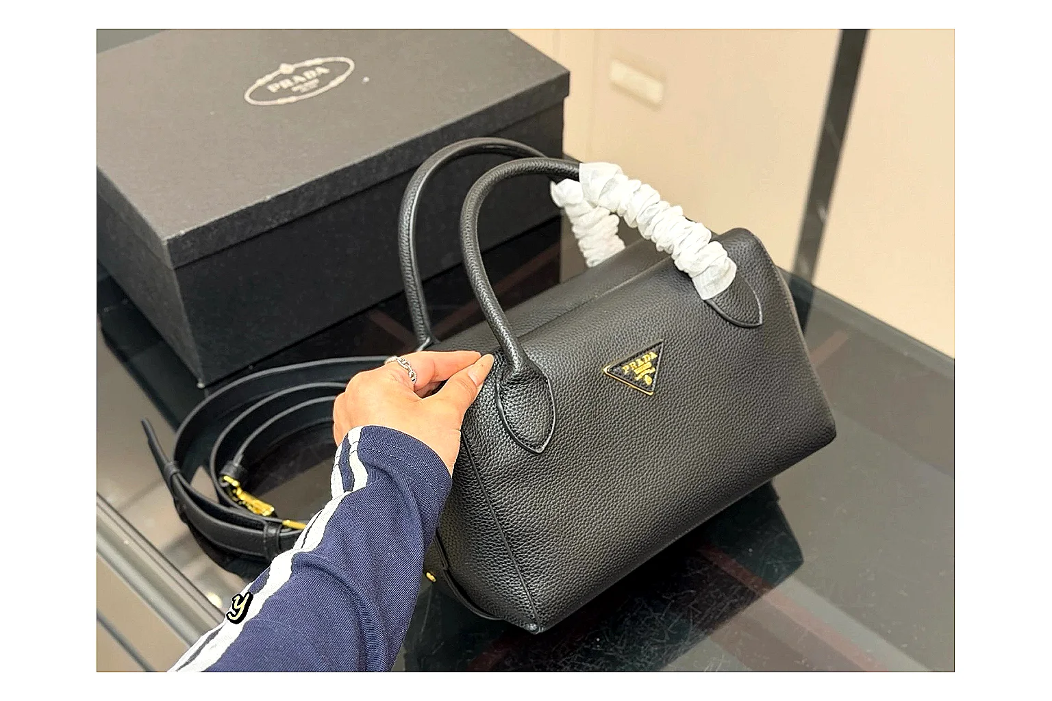 Prada Mini Top Handle Black shopping brief photo showing black leather mini bag body, structured top handle, compact silhouette, and clean metal hardware thumbnail 4