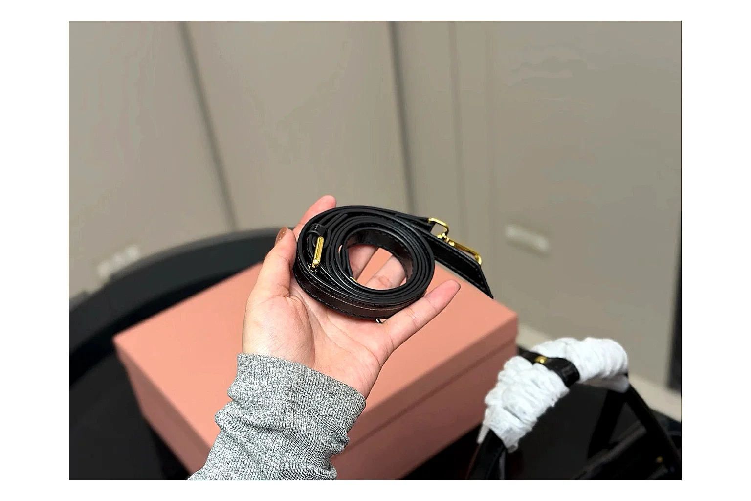 Prada Mini Top Handle Black shopping brief photo showing black leather mini bag body, structured top handle, compact luxury shape, and clean hardware details thumbnail 6
