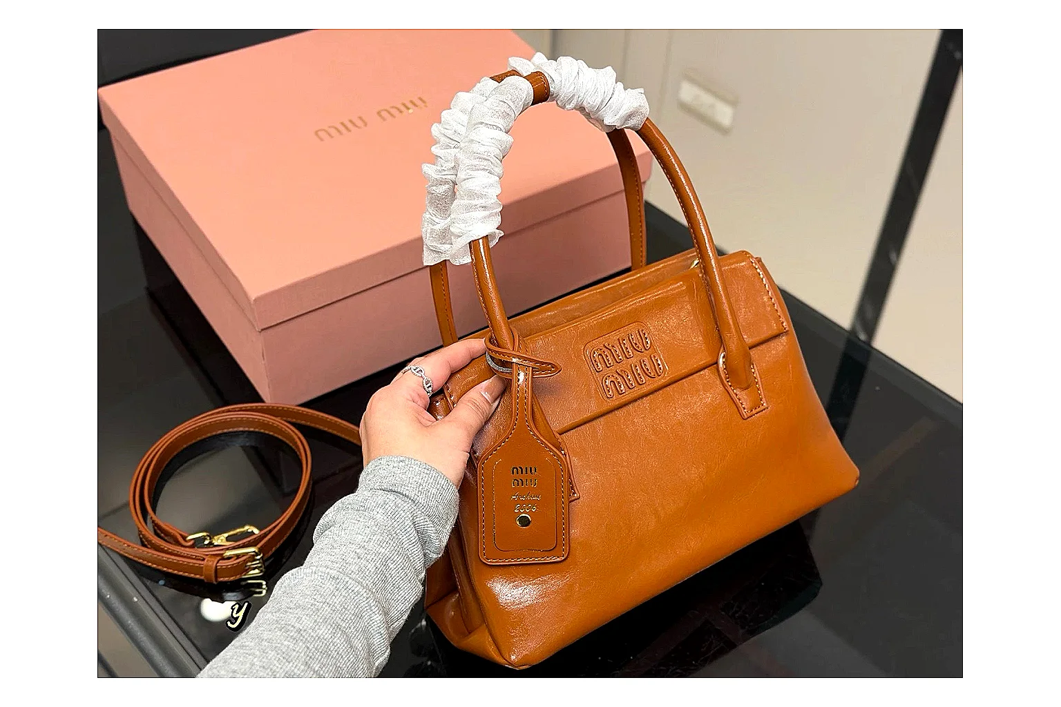 Prada Mini Top Handle Orange Brown shopping brief photo showing orange brown leather mini bag body, structured top handle, compact shape, and clean hardware details thumbnail 4