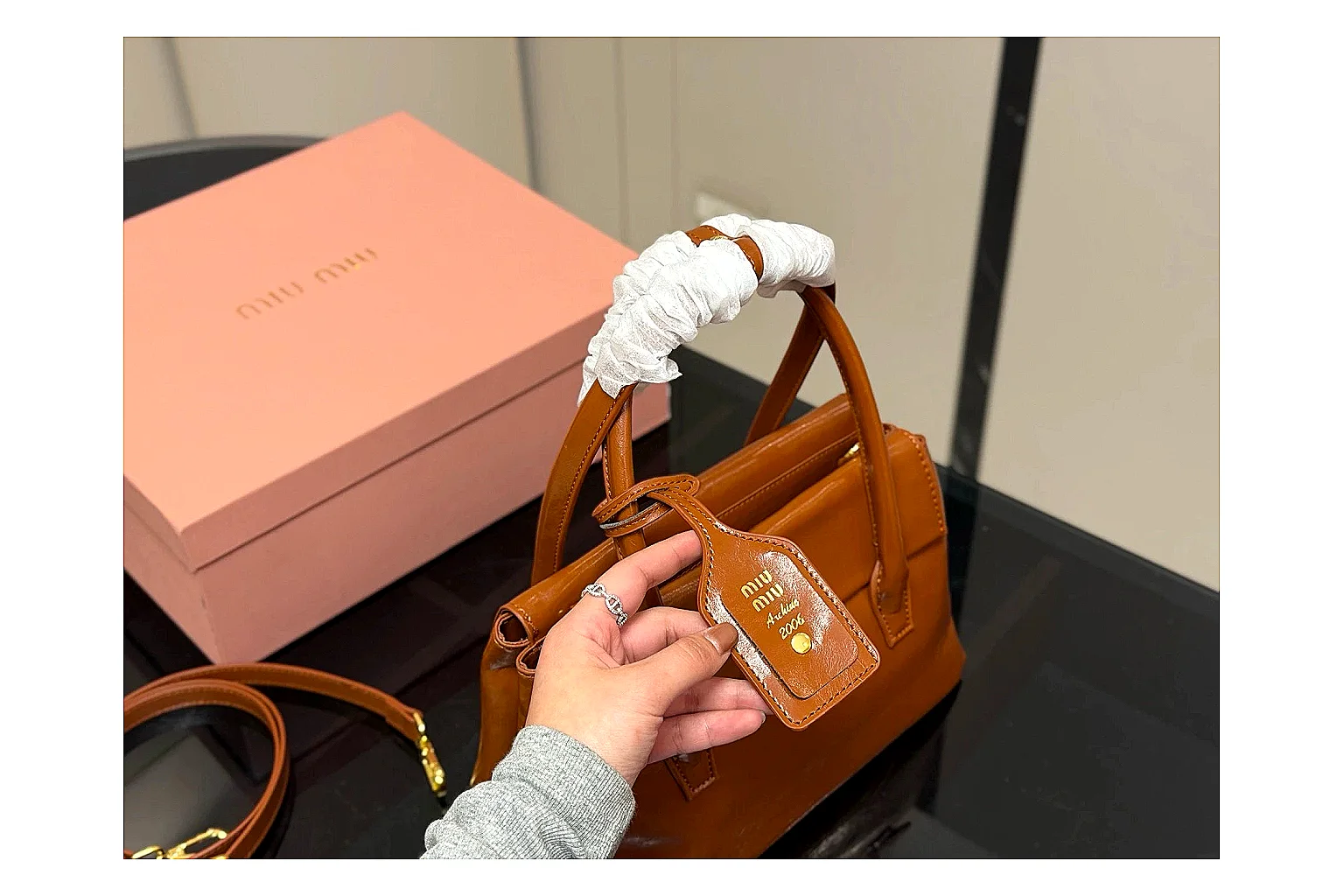 Prada Mini Top Handle Orange Brown shopping brief photo showing orange brown leather mini bag body, structured top handle, compact shape, and clean hardware details thumbnail 5